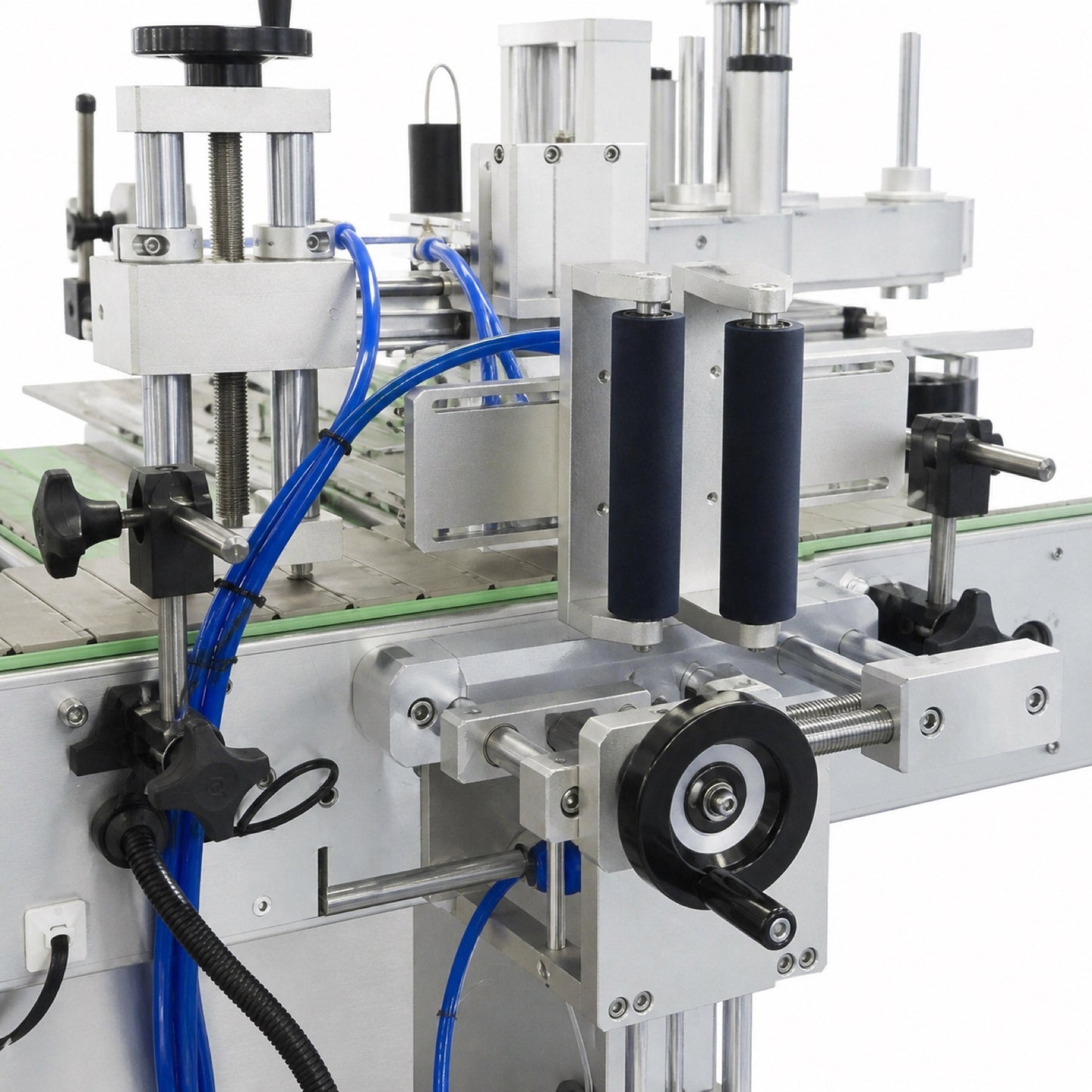 
                  
                    Leadlife LLA-A2 labeling machine labeling station above the bottle conveyor
                  
                