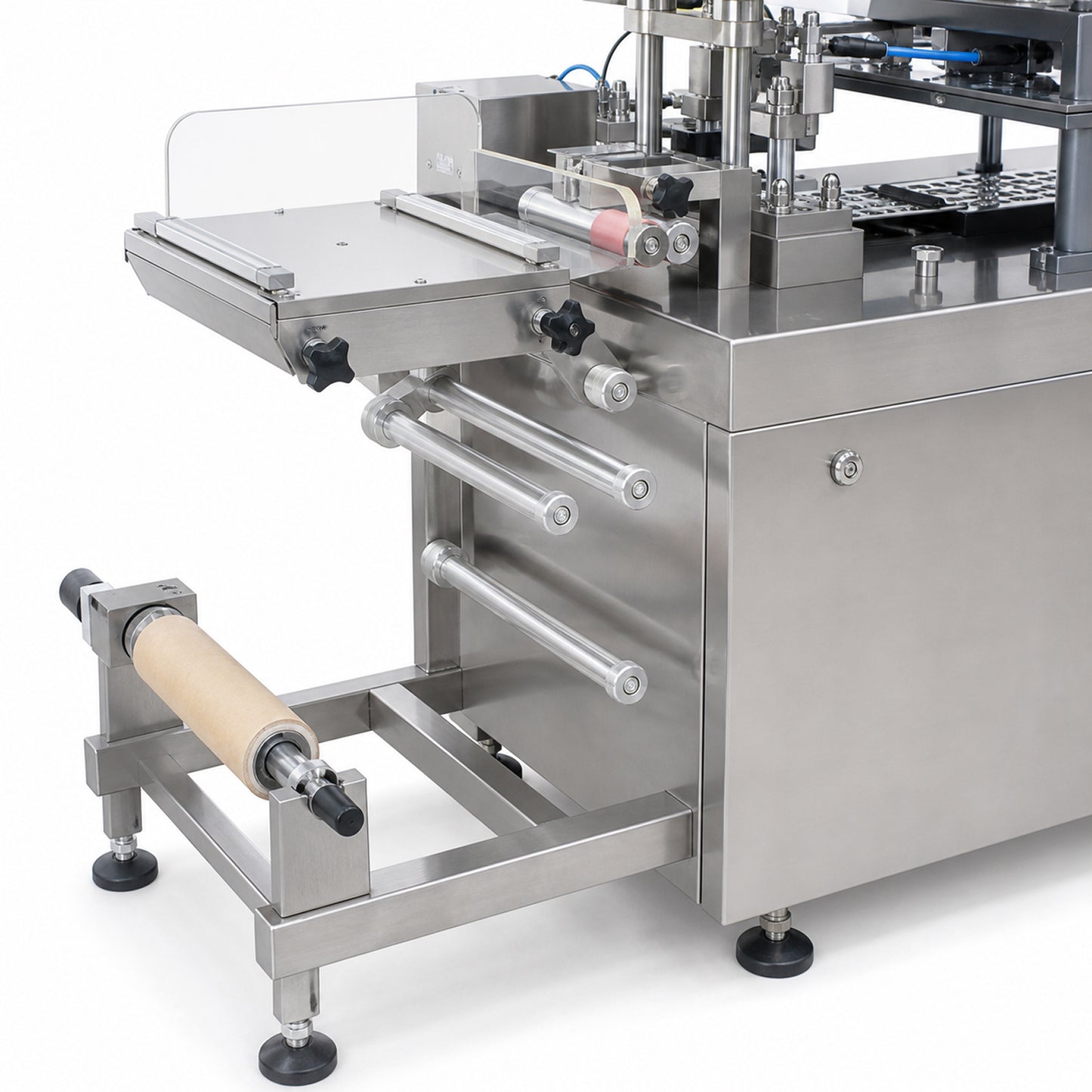 
                  
                    Forming film roll and feed rollers on the high speed blister packing machine
                  
                