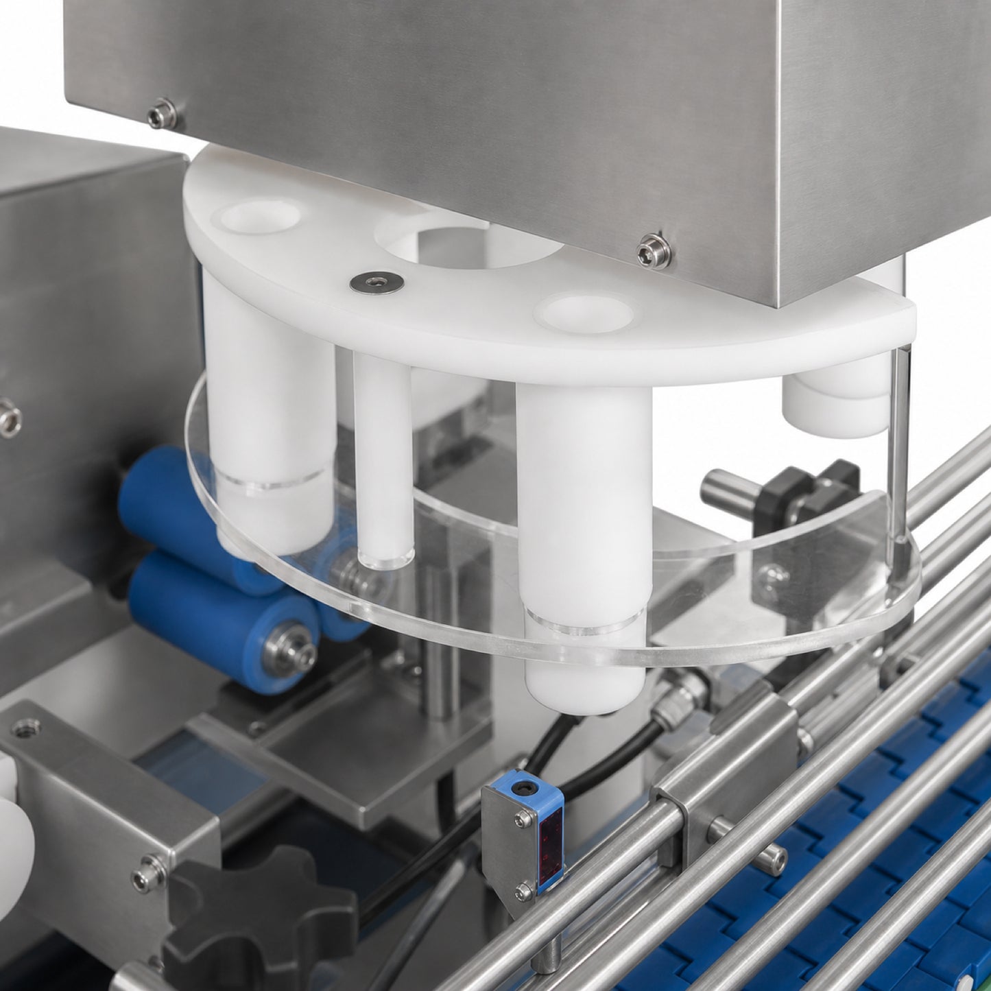 
                  
                    Automatic cotton inserter for bottling lines — close-up view
                  
                