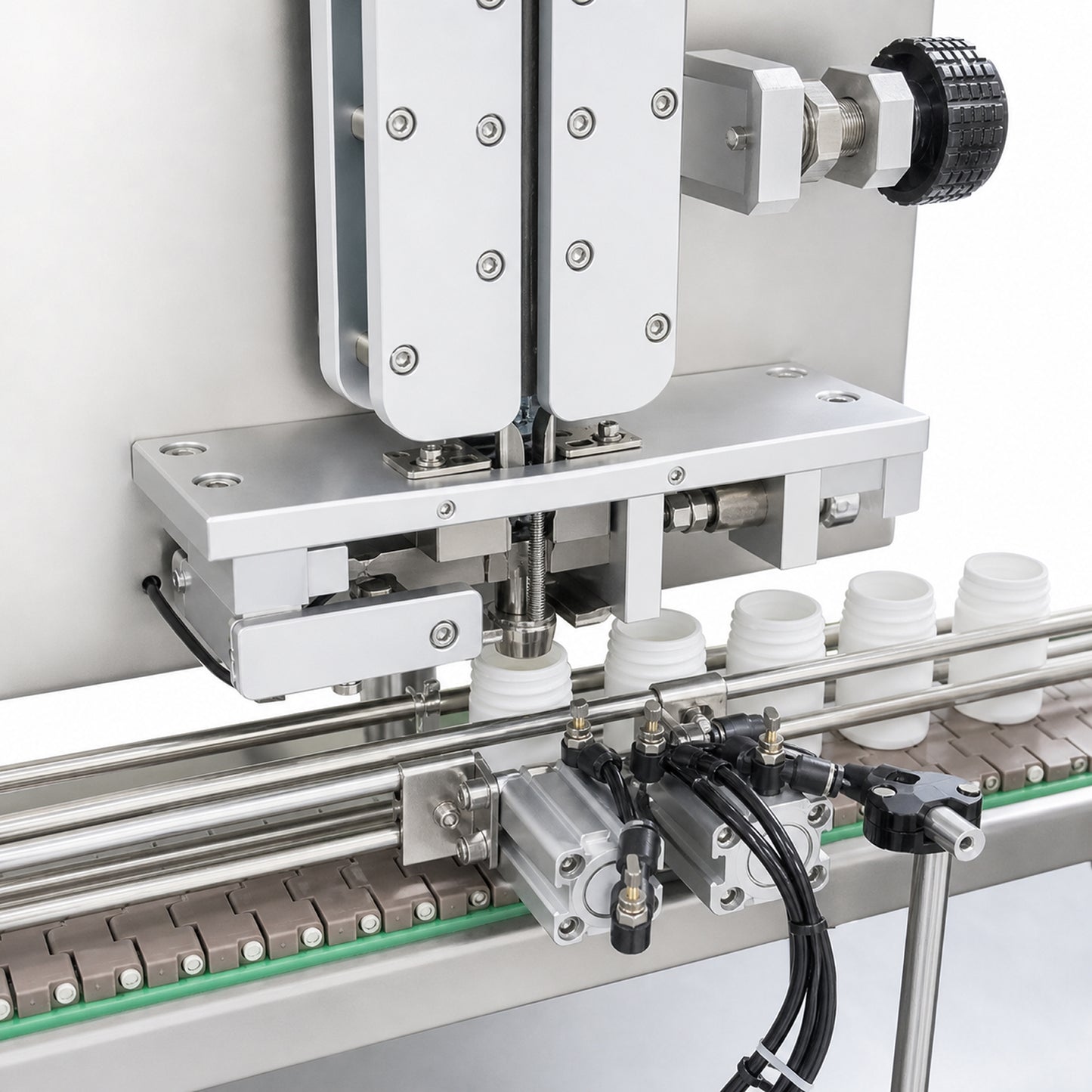 
                  
                    Automatic desiccant inserter for bottling lines — close-up view
                  
                